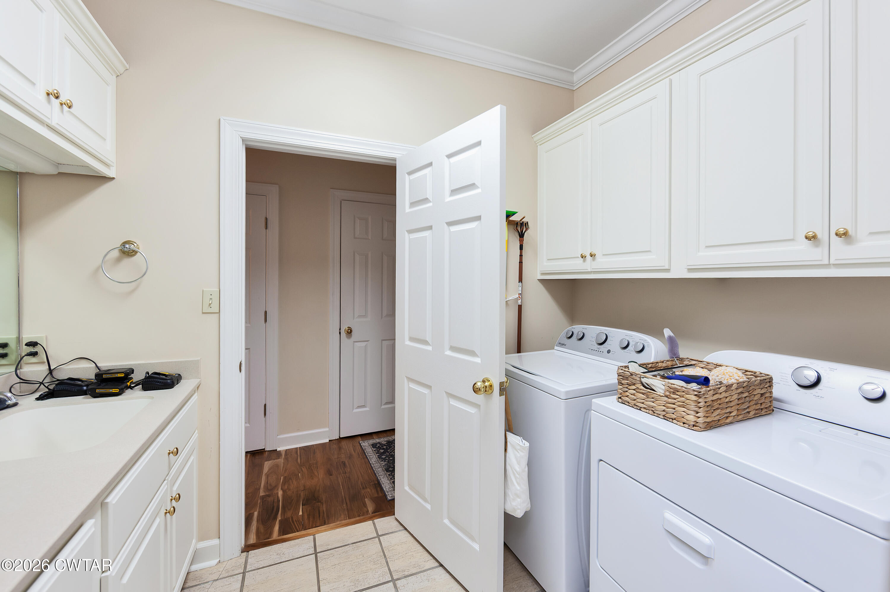 296 Liberty Claybrook Road Beech Bluff, TN 38313 - Photo 18 of 33 a utility room with cabinets washer and dryer