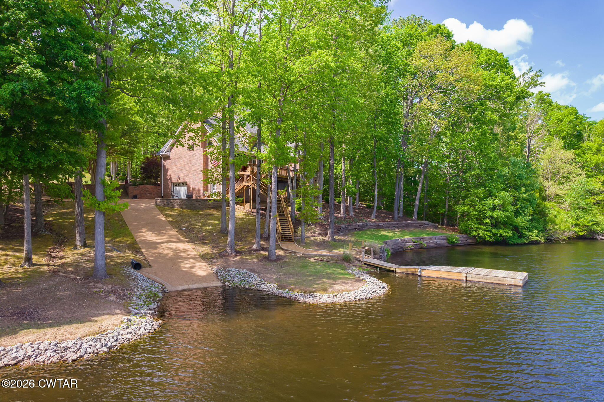 296 Liberty Claybrook Road Beech Bluff, TN 38313 - Photo 2 of 33 a view of a lake with a house