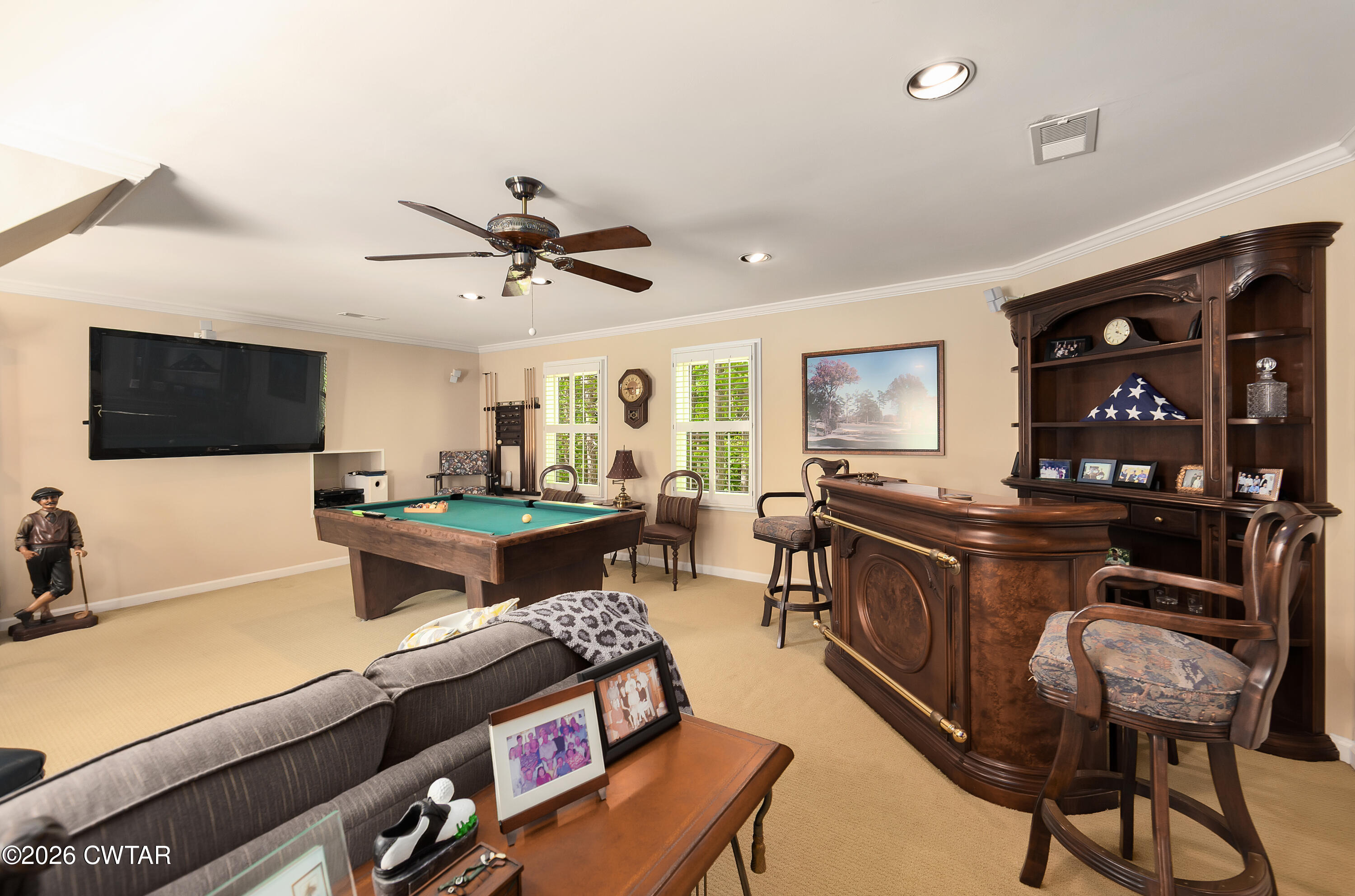 296 Liberty Claybrook Road Beech Bluff, TN 38313 - Photo 23 of 33 a living room with furniture a flat screen tv and kitchen view