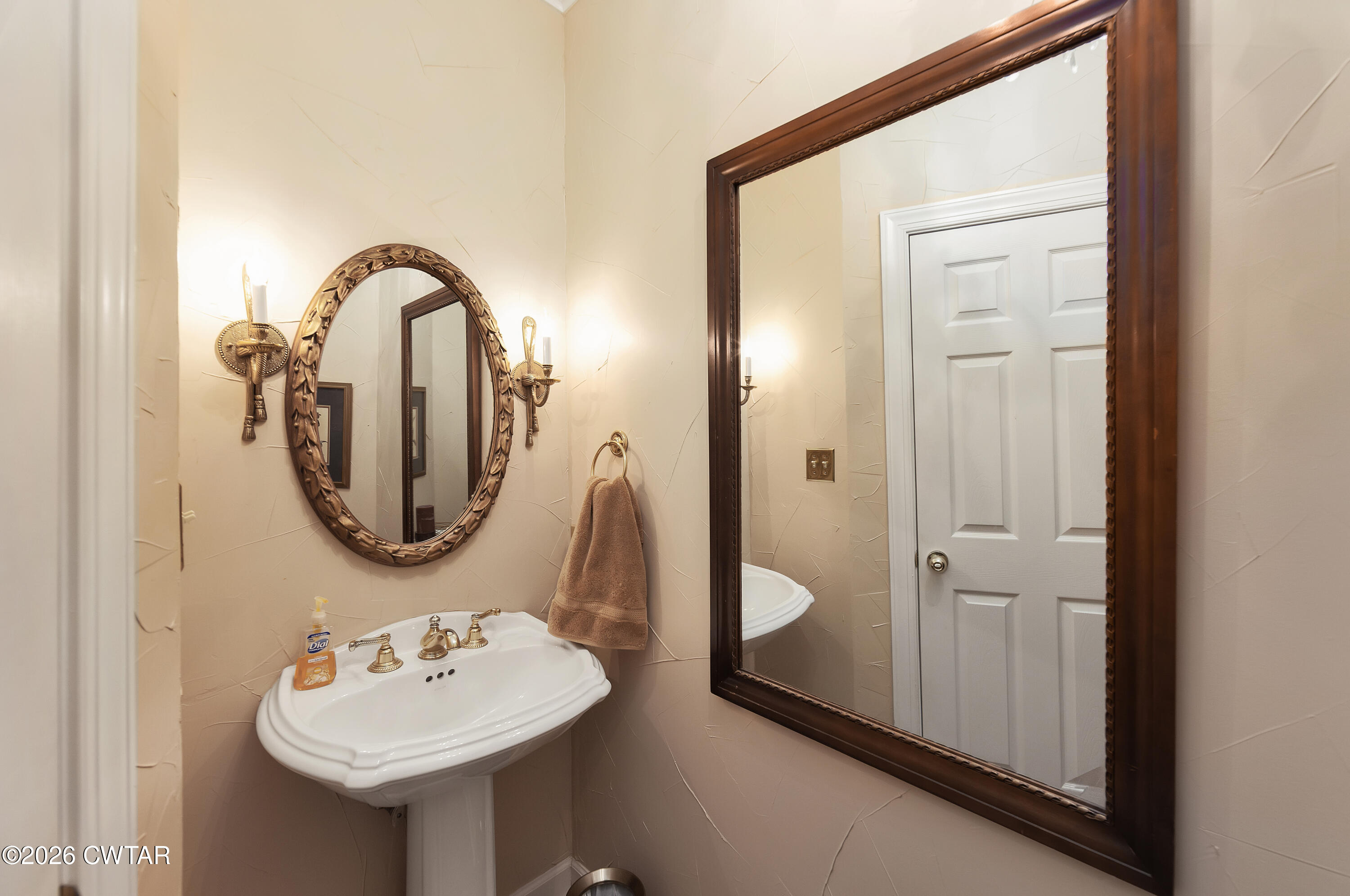 296 Liberty Claybrook Road Beech Bluff, TN 38313 - Photo 24 of 33 a bathroom with a sink and a mirror