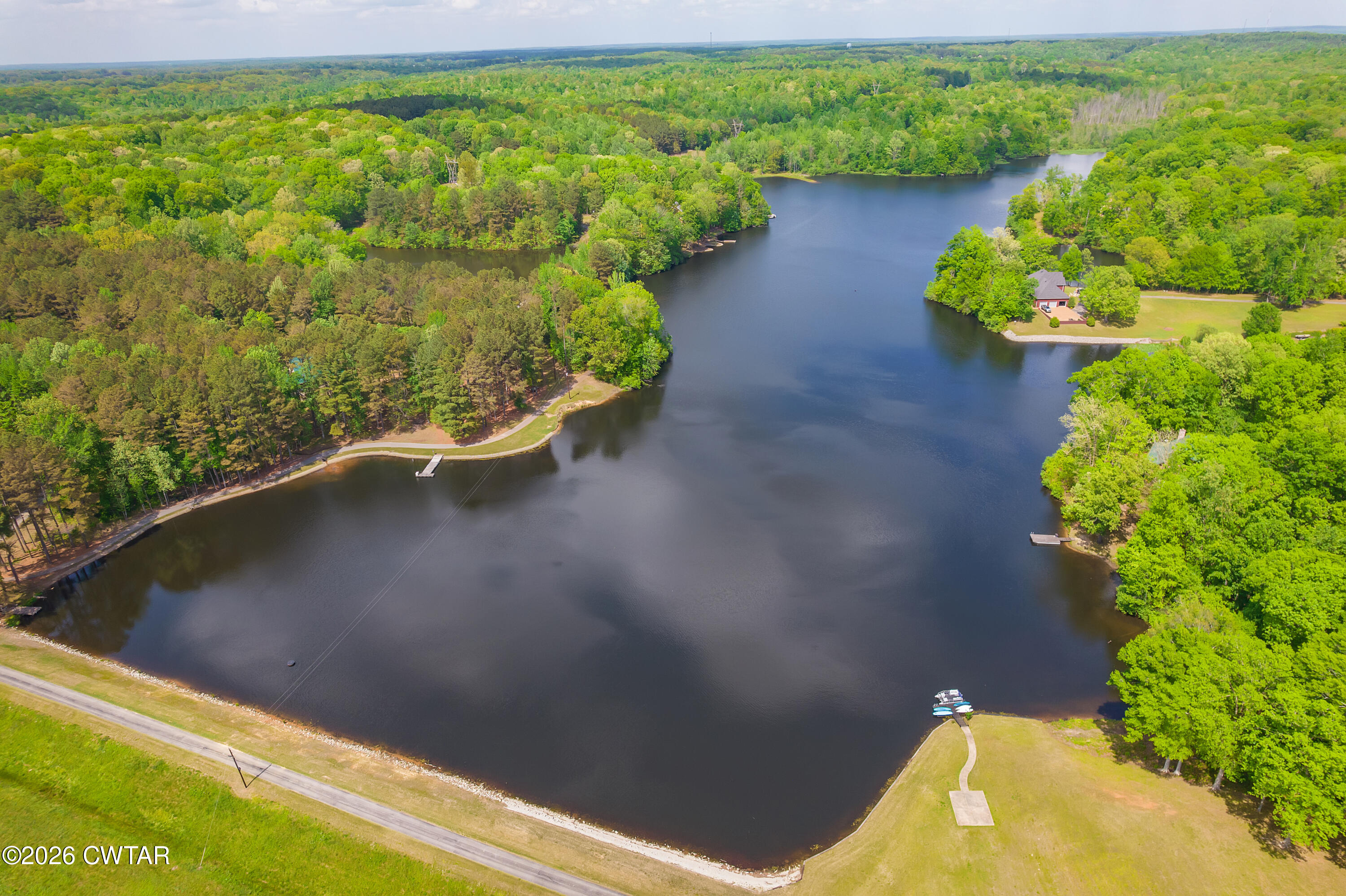 296 Liberty Claybrook Road Beech Bluff, TN 38313 - Photo 3 of 33 a view of a lake with a yard