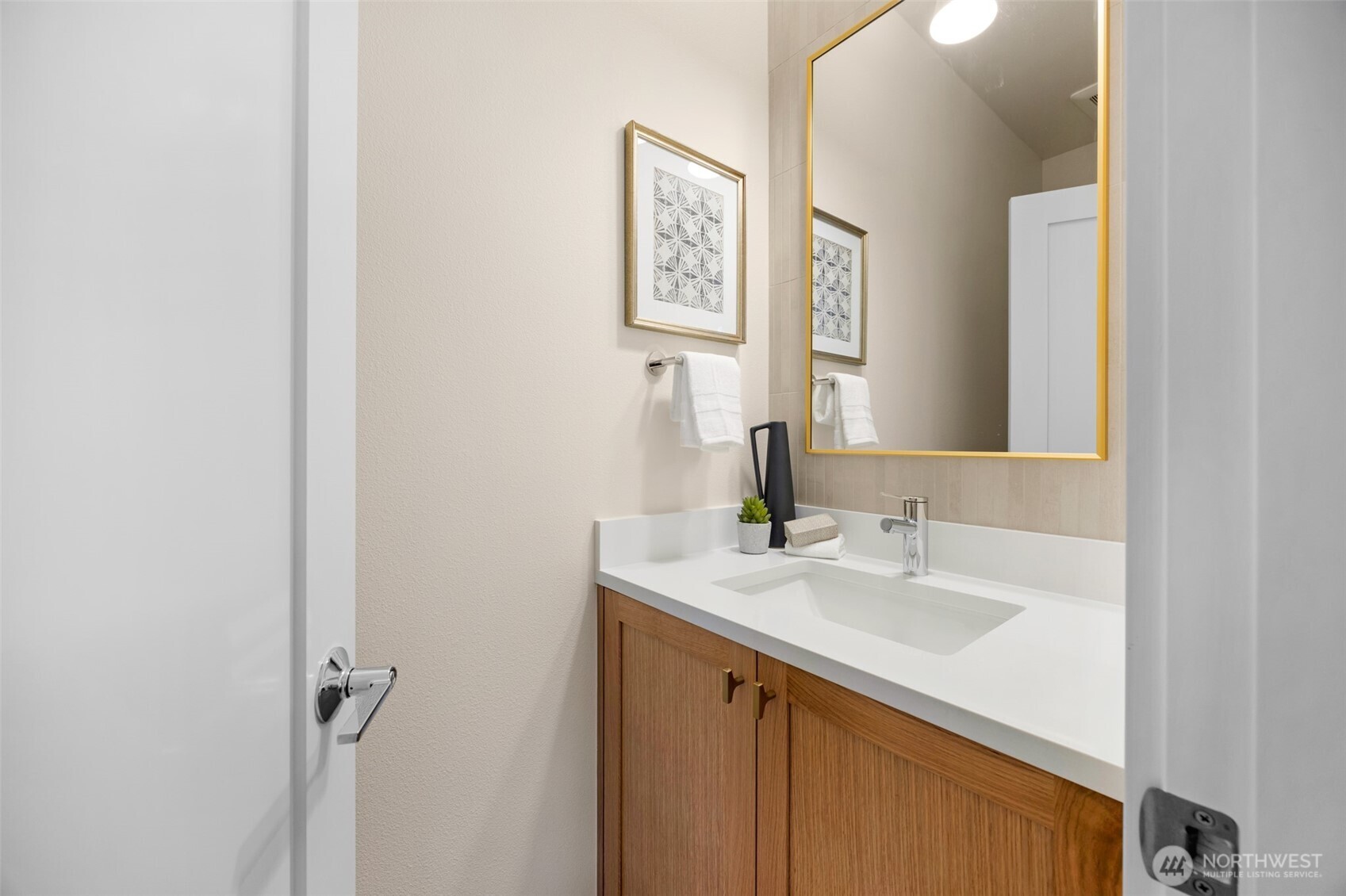 1416 North 47th Street, Unit B Seattle, WA 98103 - Photo 17 of 33 a bathroom with a sink and a mirror