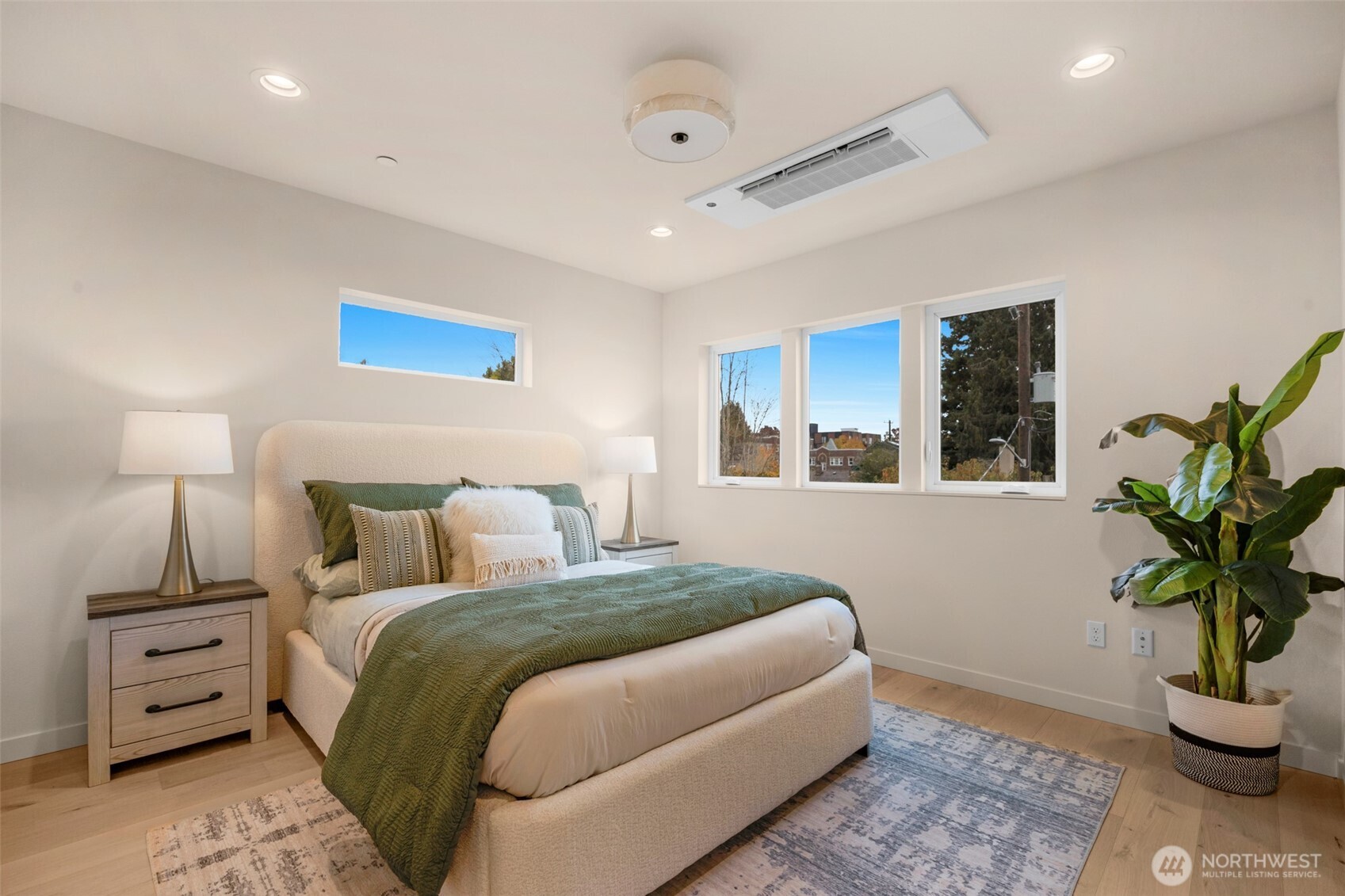 1416 North 47th Street, Unit B Seattle, WA 98103 - Photo 21 of 33 a bedroom with a bed and a potted plant