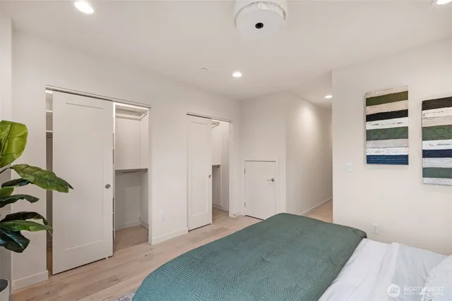 a bedroom with a bed and a walk in closet