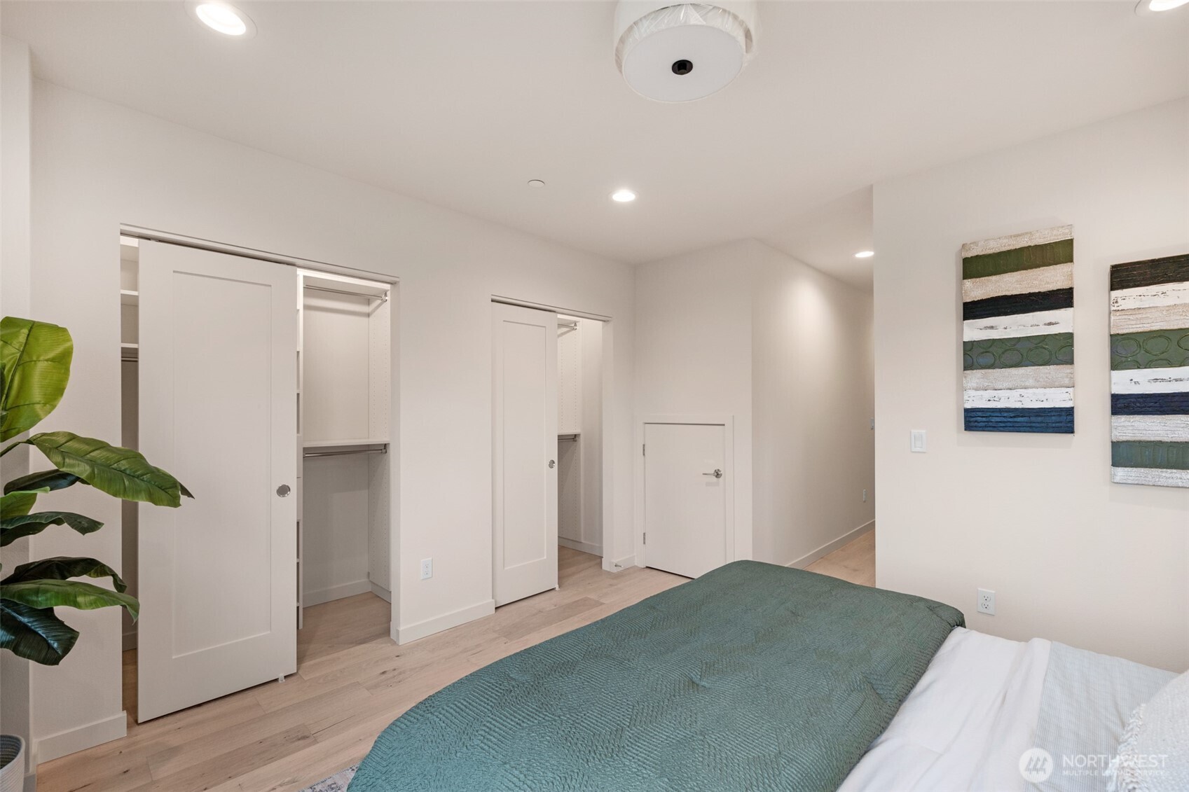 1416 North 47th Street, Unit B Seattle, WA 98103 - Photo 22 of 33 a bedroom with a bed and a walk in closet