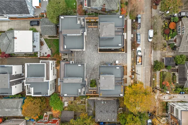 an aerial view of residential houses with outdoor space