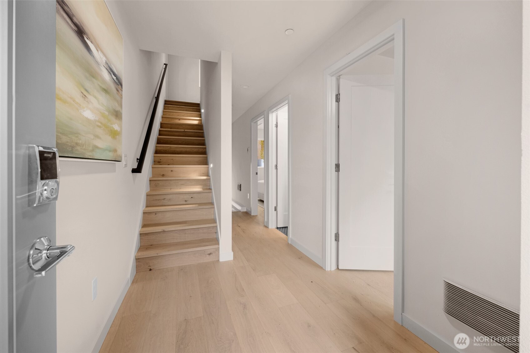 1416 North 47th Street, Unit B Seattle, WA 98103 - Photo 4 of 33 a view of a hallway with wooden floor and entryway