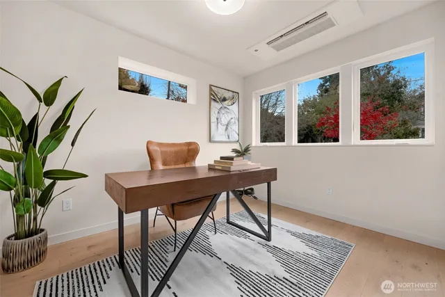 a workspace with furniture and window