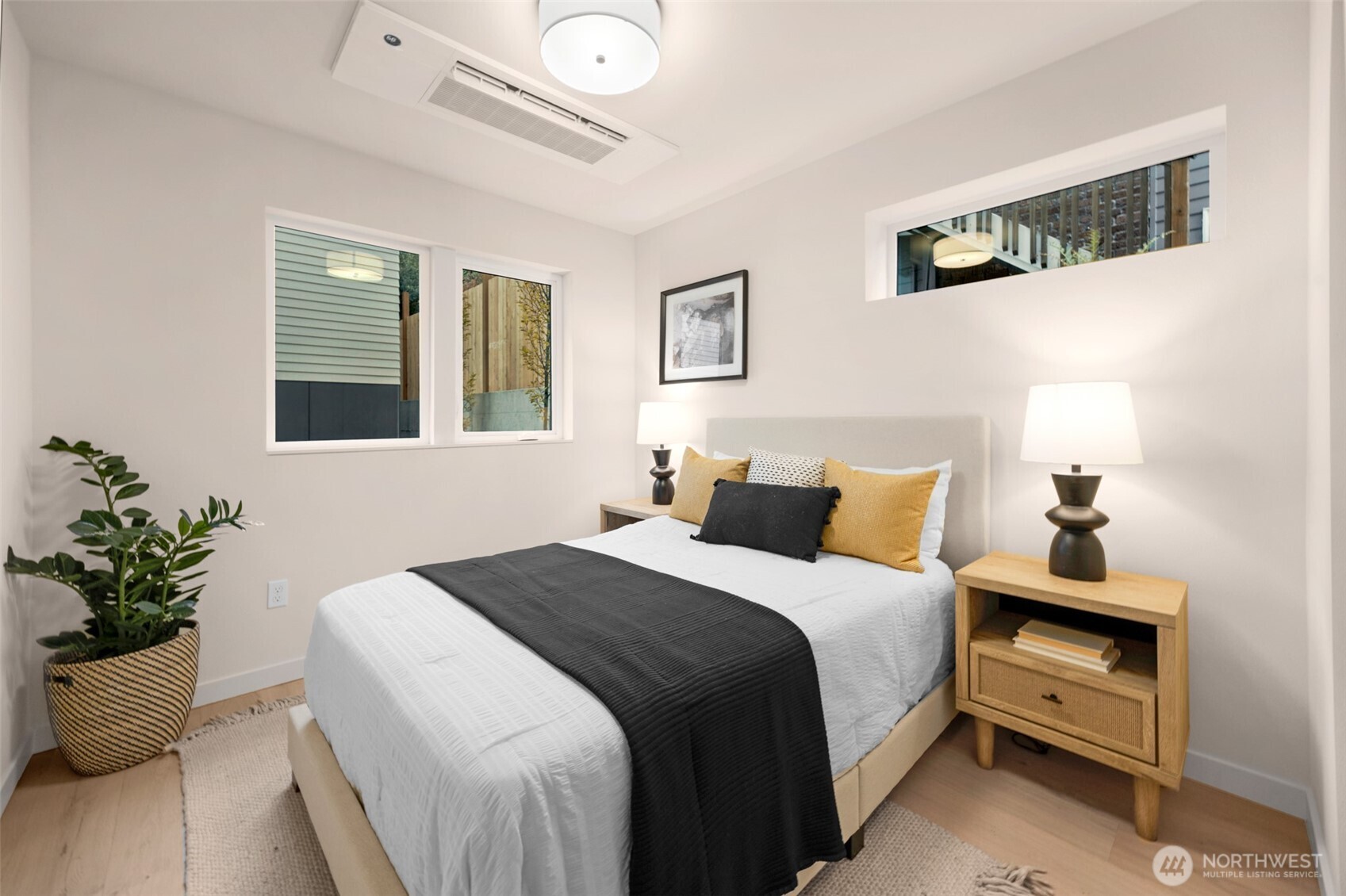 1416 North 47th Street, Unit B Seattle, WA 98103 - Photo 7 of 33 a bedroom with a bed and a potted plant