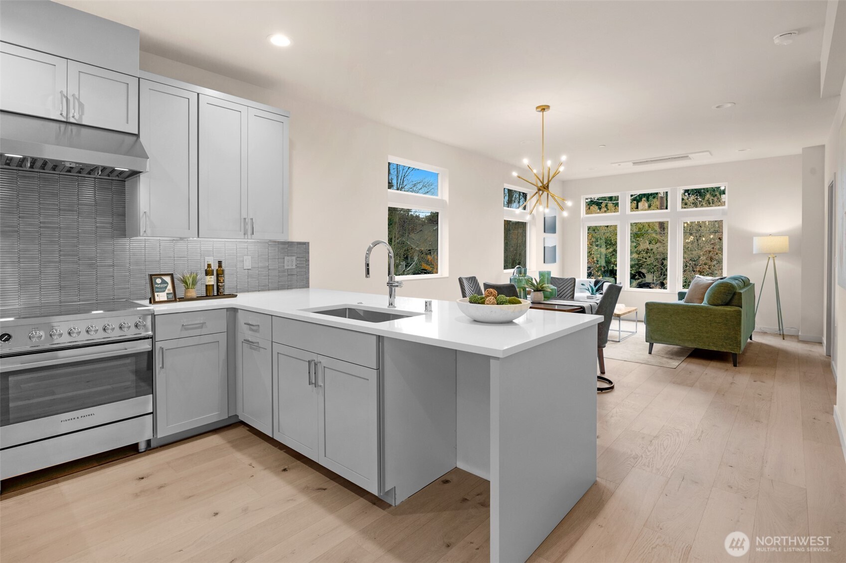 1416 North 47th Street, Unit B Seattle, WA 98103 - Photo 9 of 33 a kitchen with sink refrigerator and cabinets