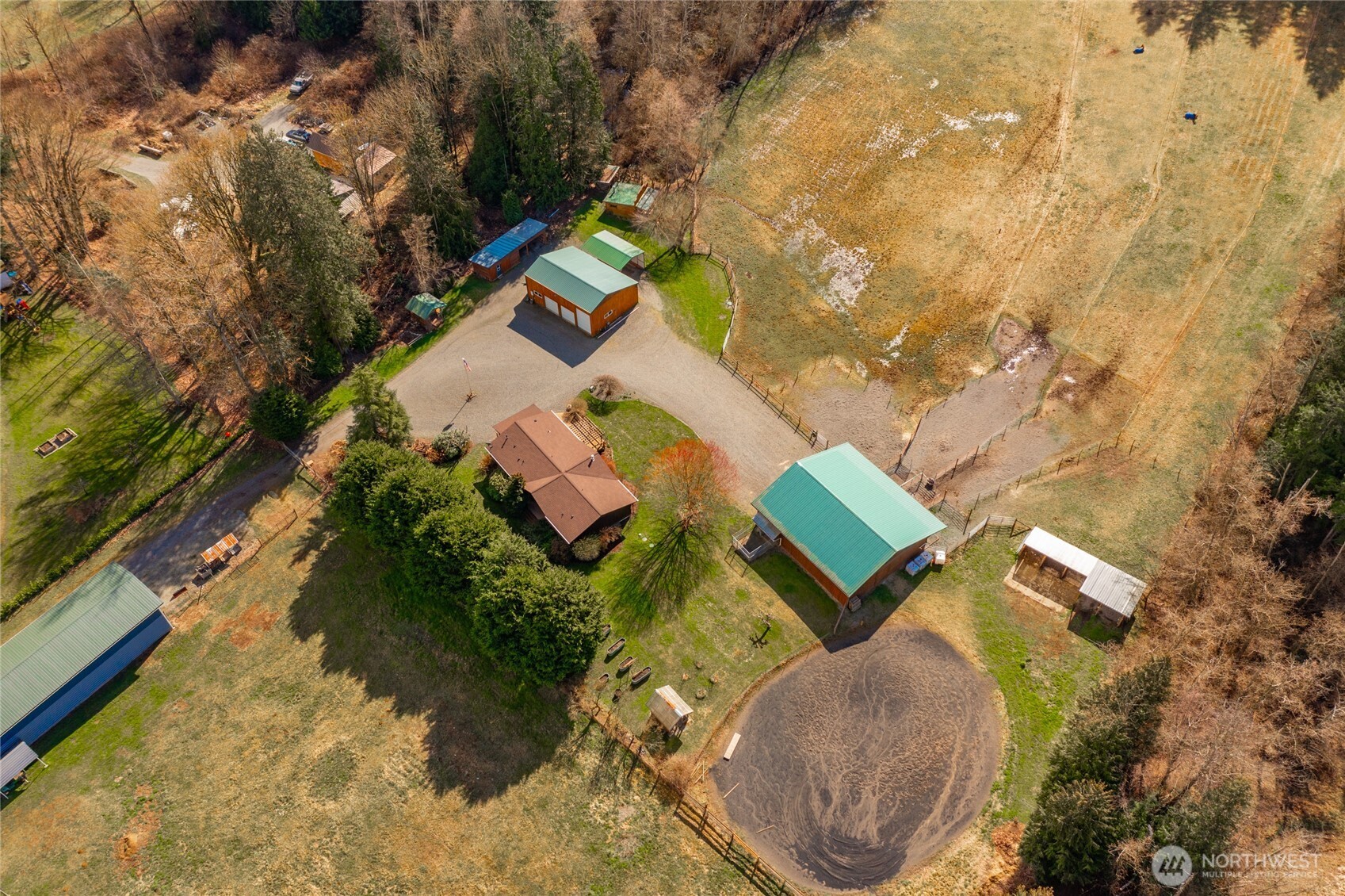an aerial view of a house with outdoor space