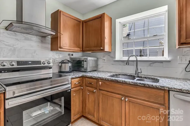 a kitchen with cabinets appliances and a sink