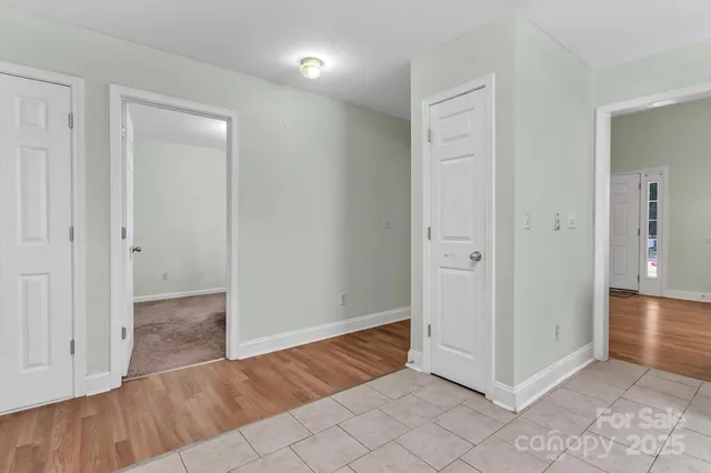 an empty room with wooden floor