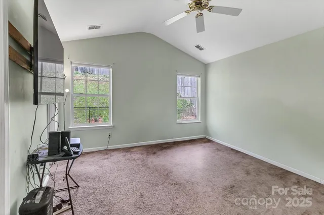 a view of workspace with furniture and windows