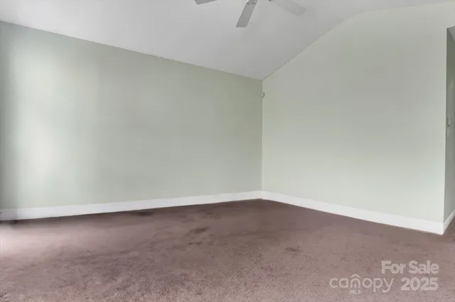 an empty room with a empty space and a window