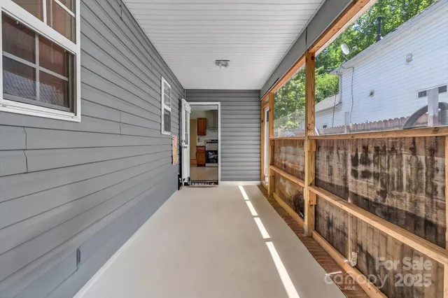 a view of balcony with wooden floor and stairs