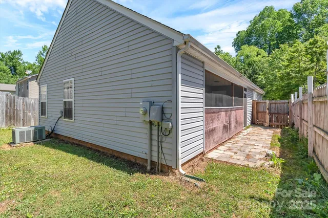 a view of a backyard with a large tree