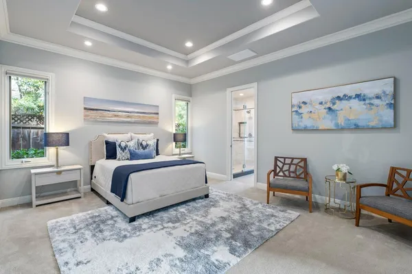 a bedroom with a bed and a couch