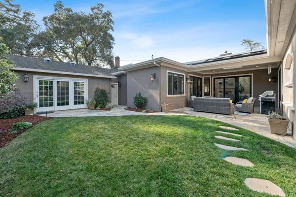 a front view of house with yard and green space