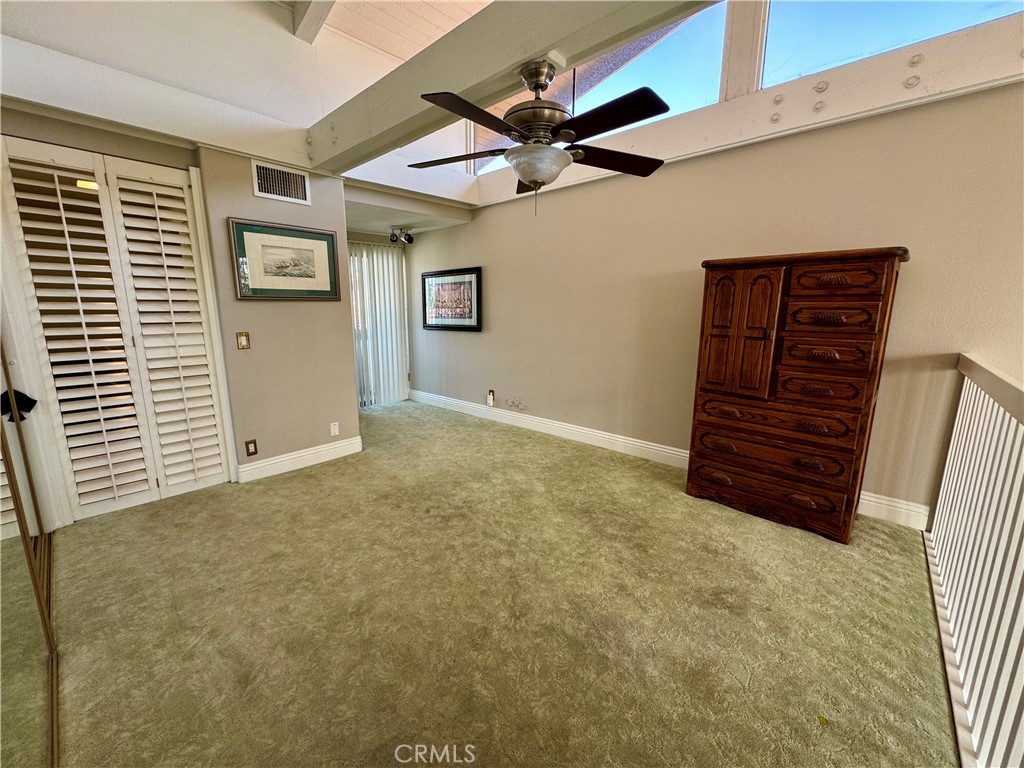 6312 Marina Pacifica Drive Long Beach, CA 90803 - Photo 13 of 30 a view of room with stairs and a ceiling fan