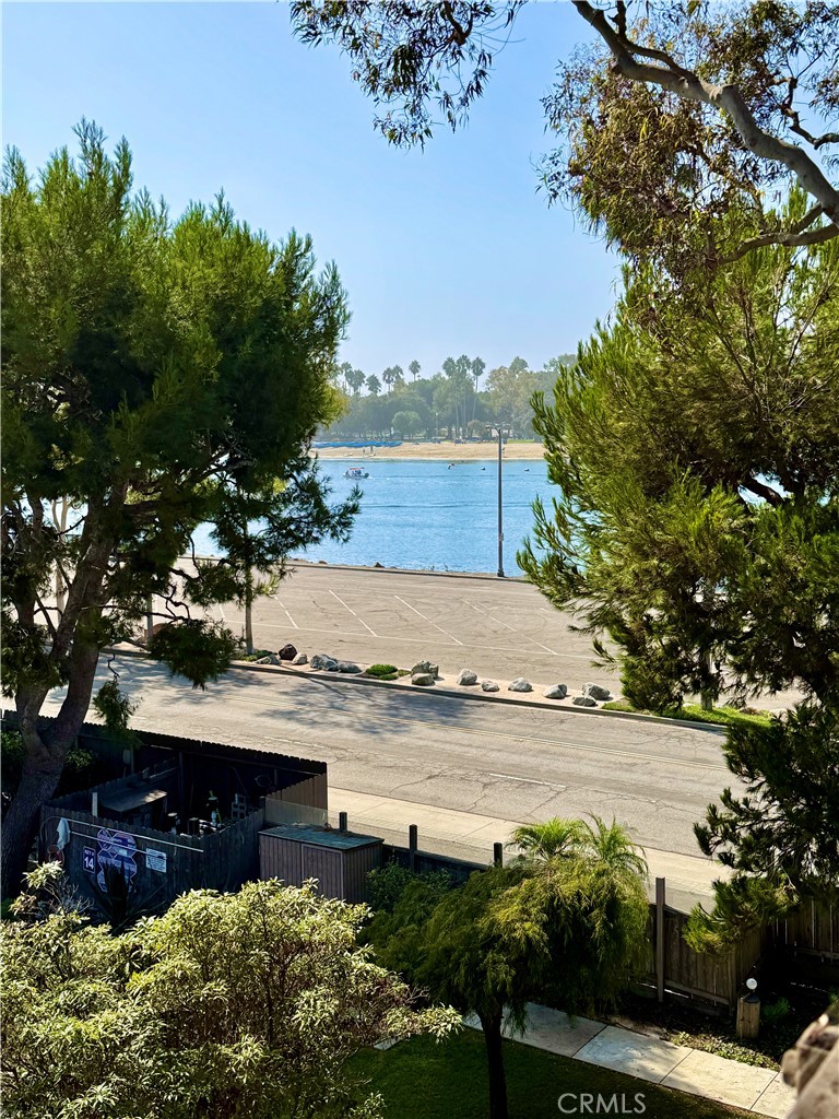 6312 Marina Pacifica Drive Long Beach, CA 90803 - Photo 22 of 30 a view of a lake with a building in the background