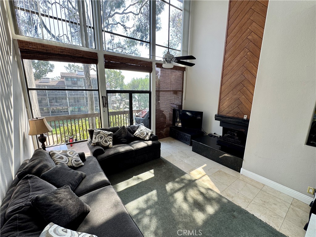 6312 Marina Pacifica Drive Long Beach, CA 90803 - Photo 9 of 30 a living room with furniture and a floor to ceiling window