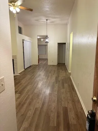 a view of a livingroom with wooden floor