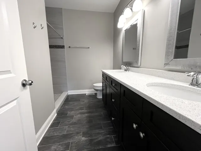 a bathroom with a sink a vanity and a mirror