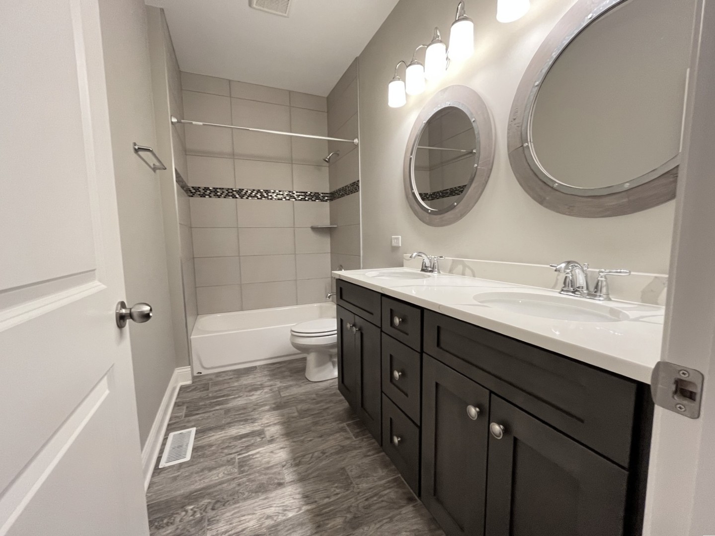 855 Meadow Lane Marengo, IL 60152 - Photo 13 of 22 a bathroom with a double vanity sink mirror and bathtub