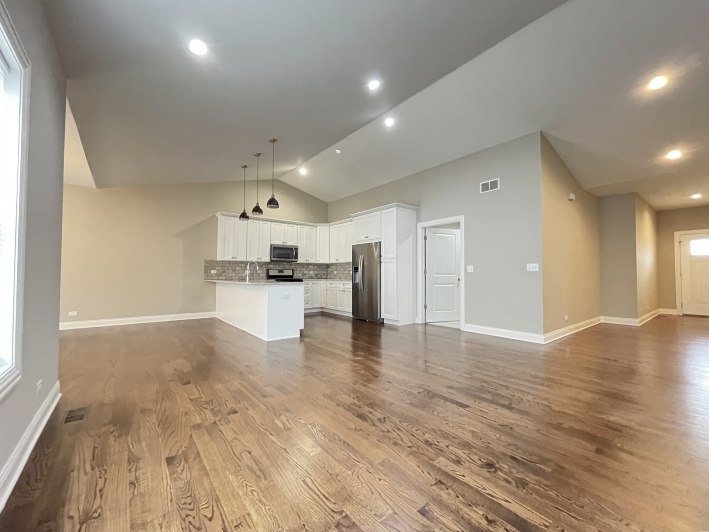 855 Meadow Lane Marengo, IL 60152 - Photo 6 of 22 a view of a kitchen with a sink and dishwasher a refrigerator with wooden floor