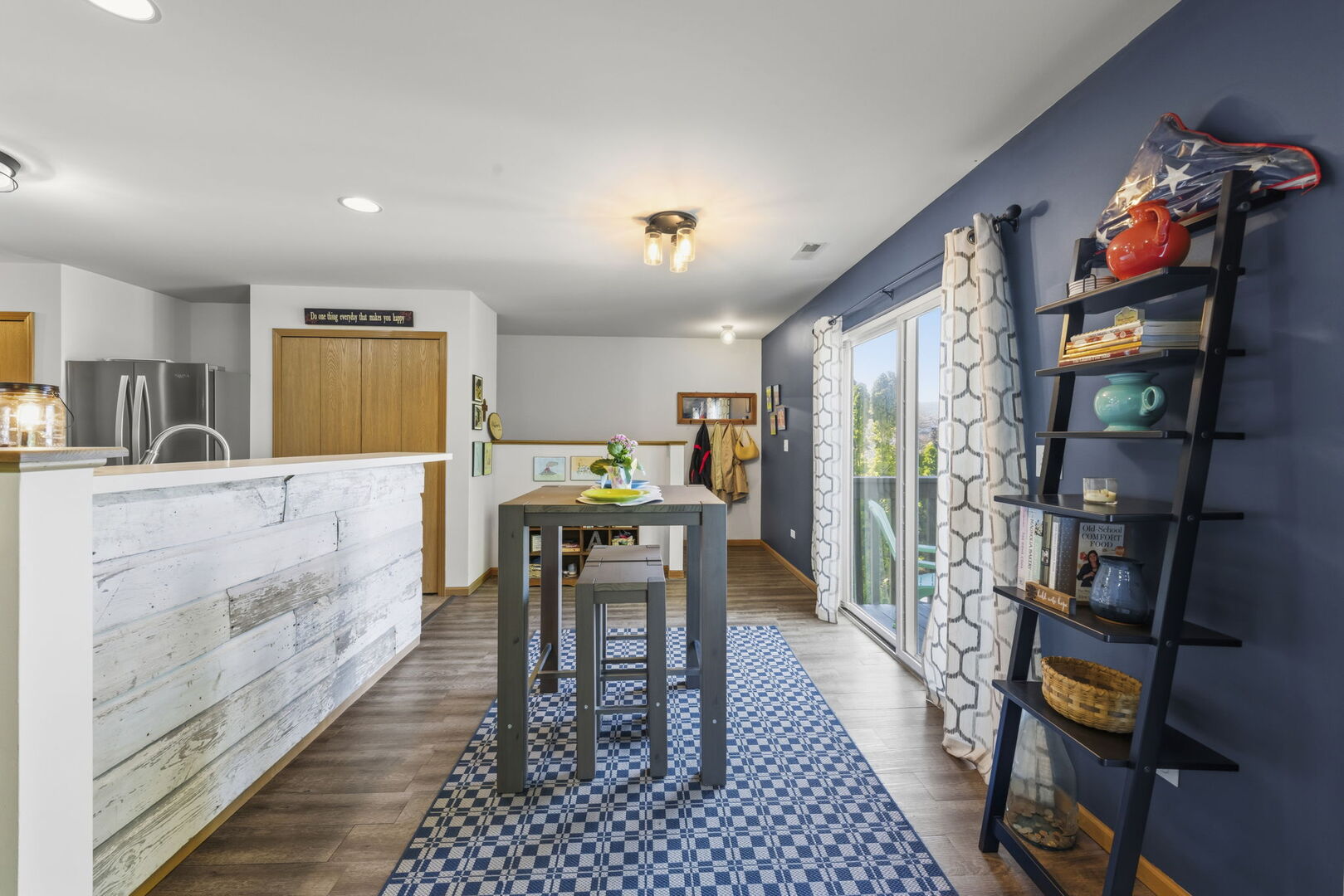 965 Constance Lane, Unit G Sycamore, IL 60178 - Photo 6 of 25 a dining room with stainless steel appliances furniture a rug and a kitchen view