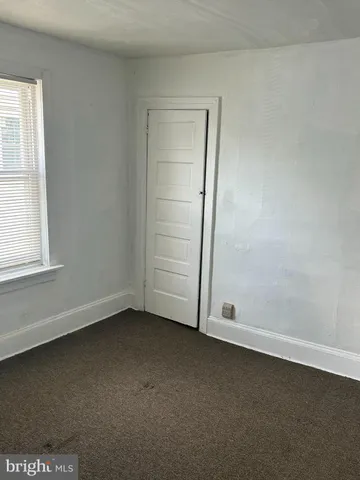 an empty room with a empty space and window