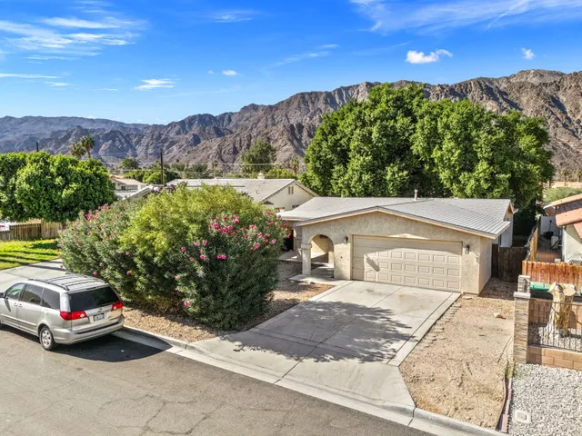 front view of a house with a garden