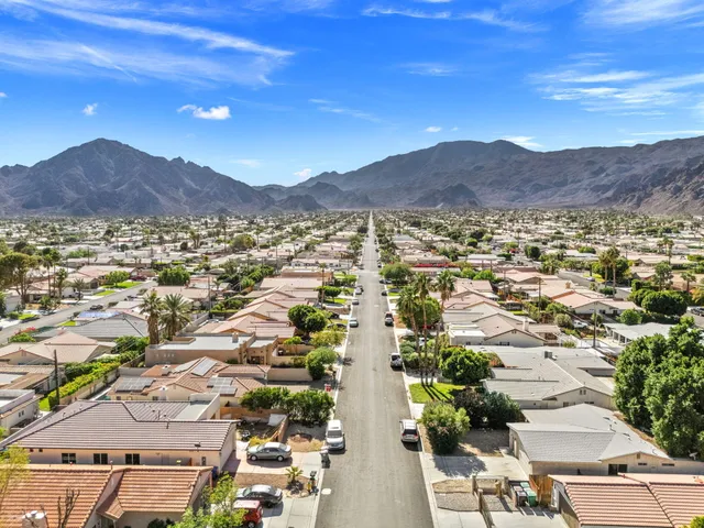 an aerial view of residential houses and outdoor space