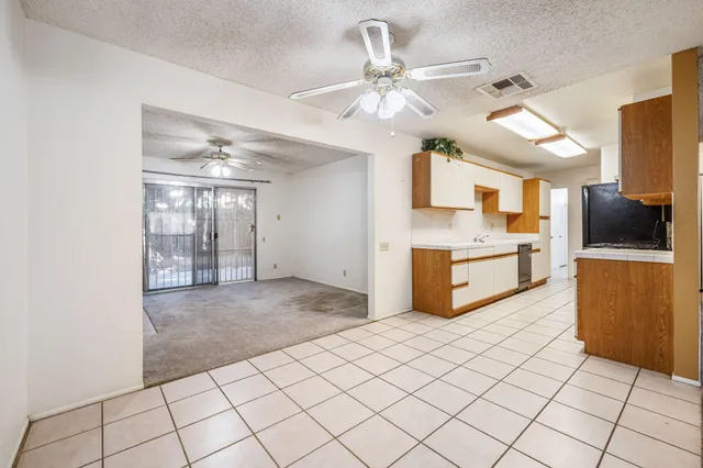 a view of a kitchen with microwave and cabinets