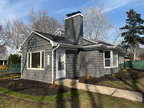 a front view of a house with yard