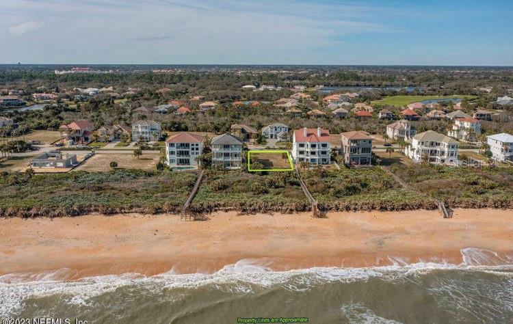 an aerial view of residential building and ocean