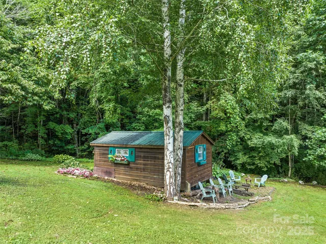 a view of a table and chairs in the garden