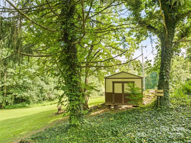 a view of a house with a tree