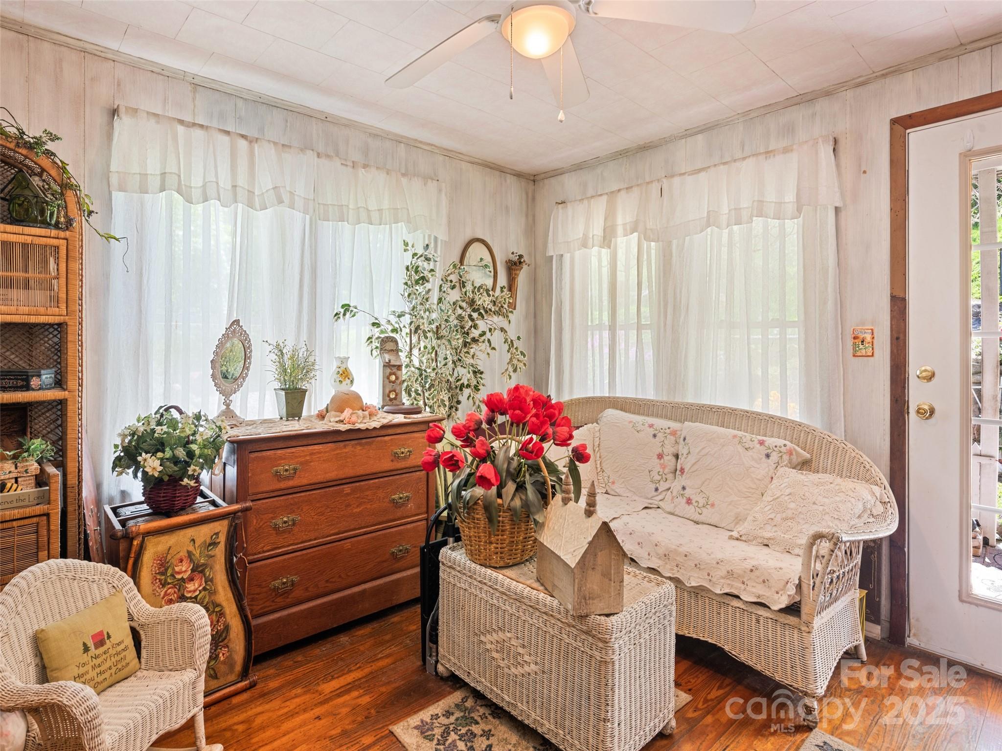 4828 Max Patch Road Clyde, NC 28721 - Photo 27 of 41 a living room with furniture and flowers