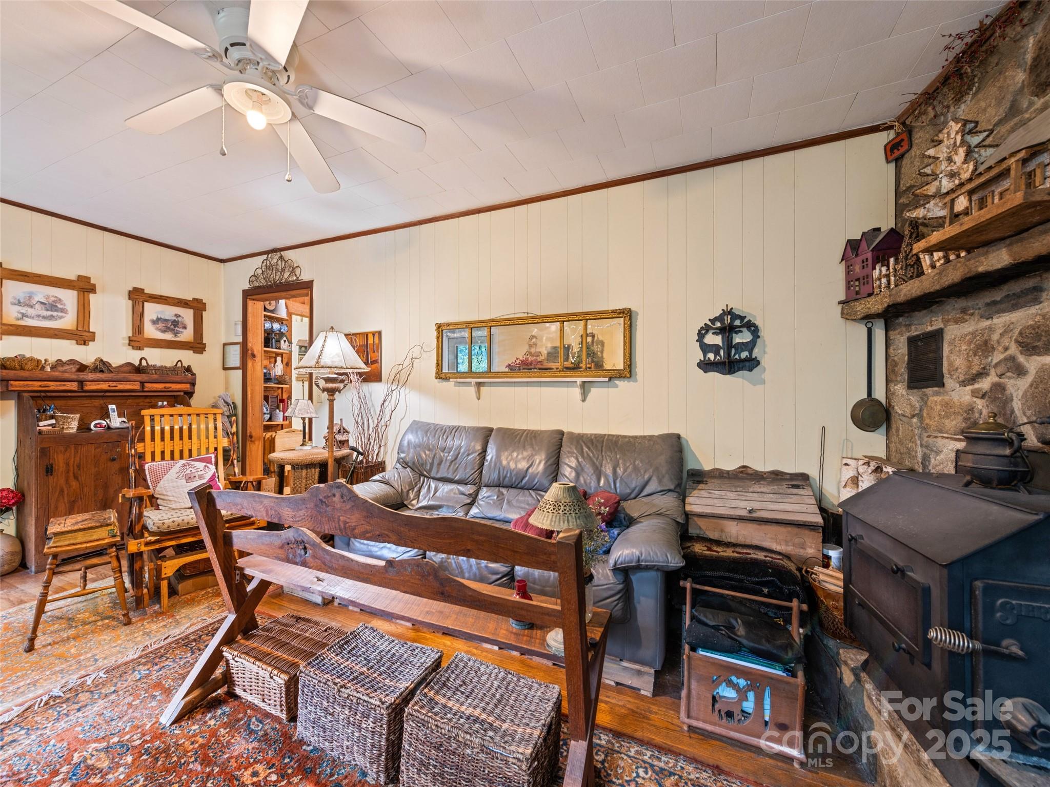 4828 Max Patch Road Clyde, NC 28721 - Photo 30 of 41 a living room with furniture and a flat screen tv