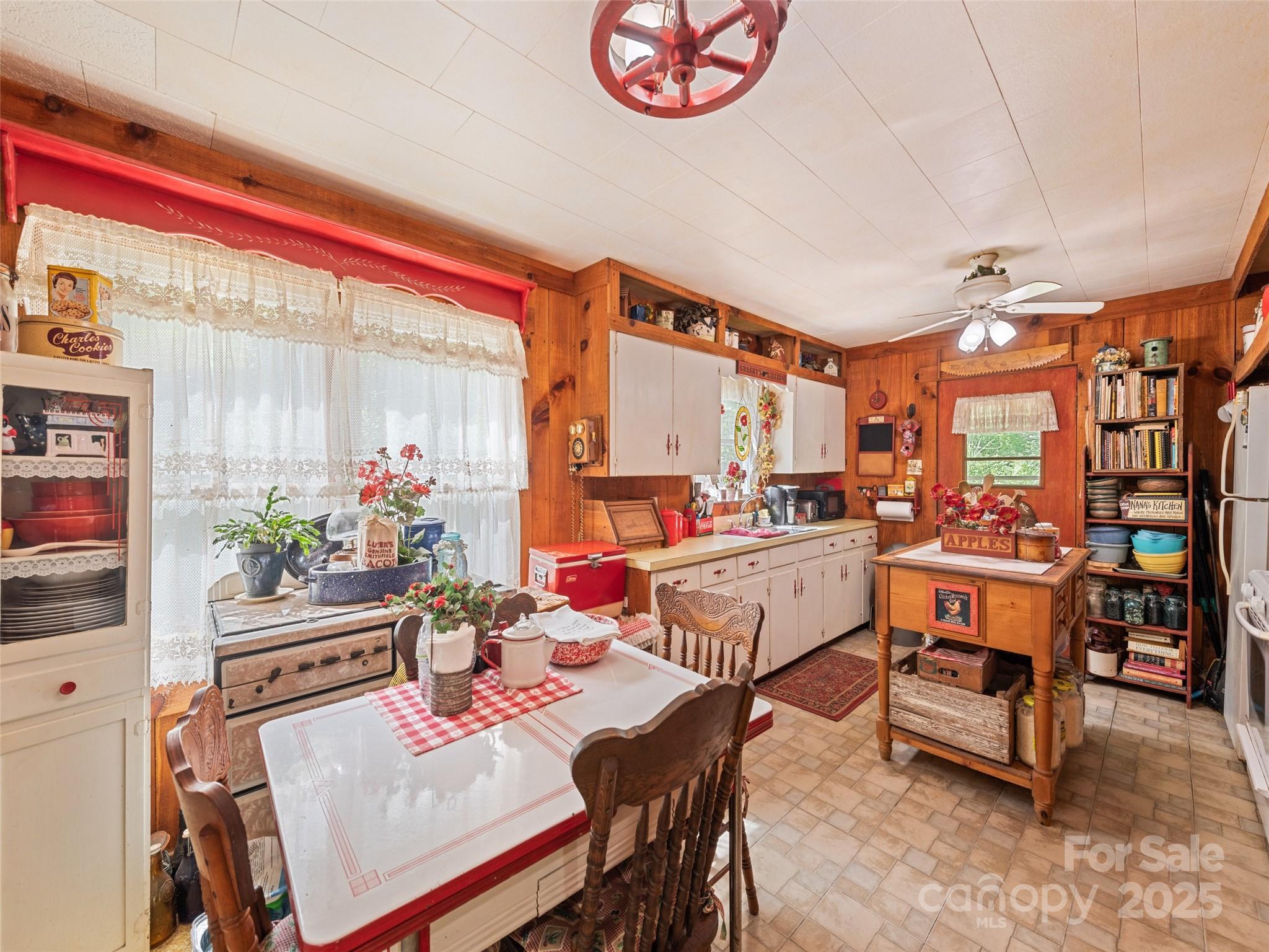 4828 Max Patch Road Clyde, NC 28721 - Photo 32 of 41 a dining room with furniture and a potted plant