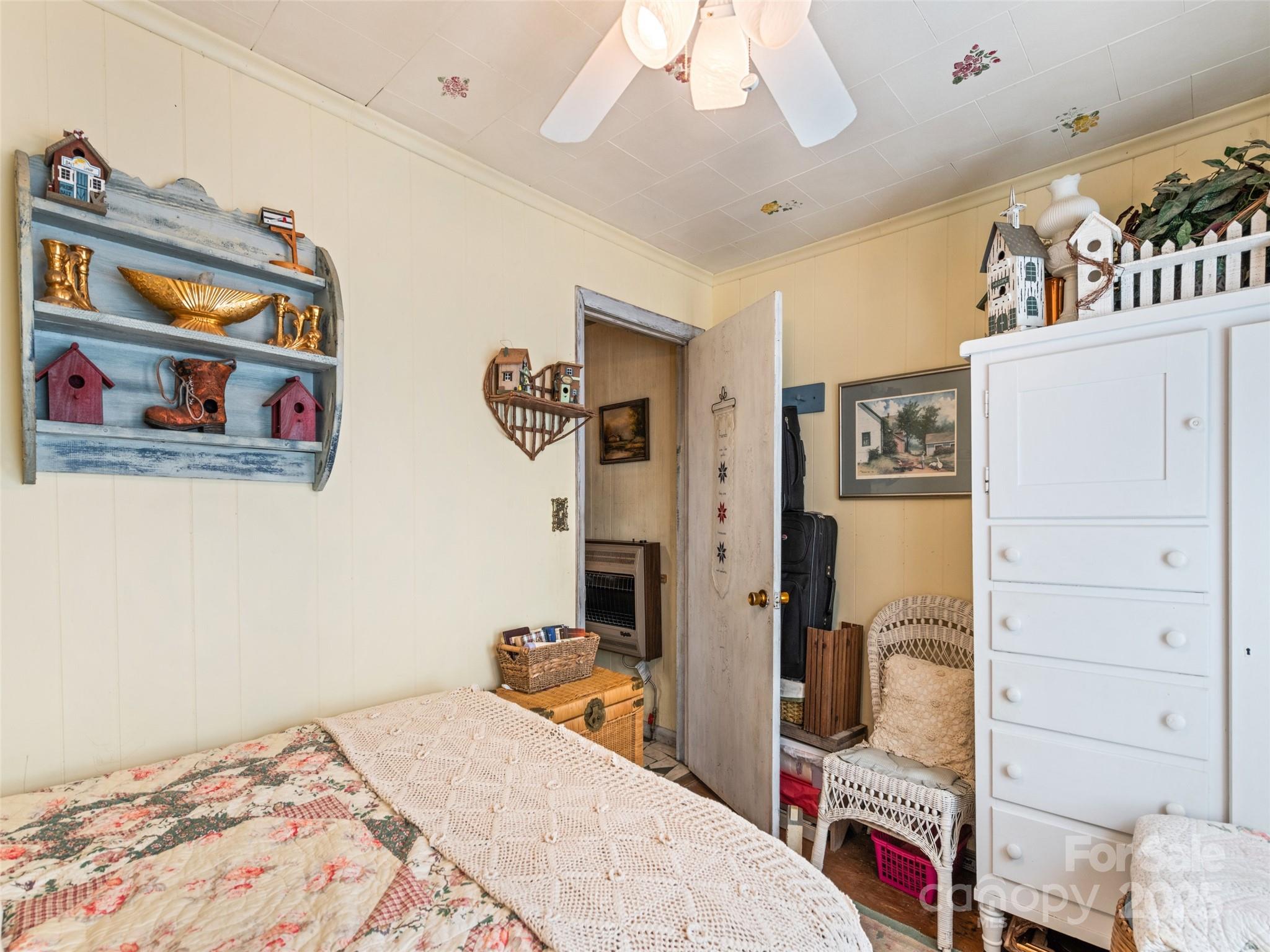 4828 Max Patch Road Clyde, NC 28721 - Photo 41 of 41 a bedroom with a bed and a flat screen tv