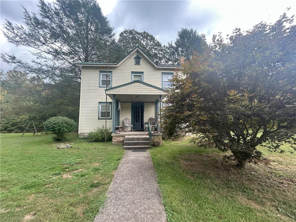 front view of a house with a yard