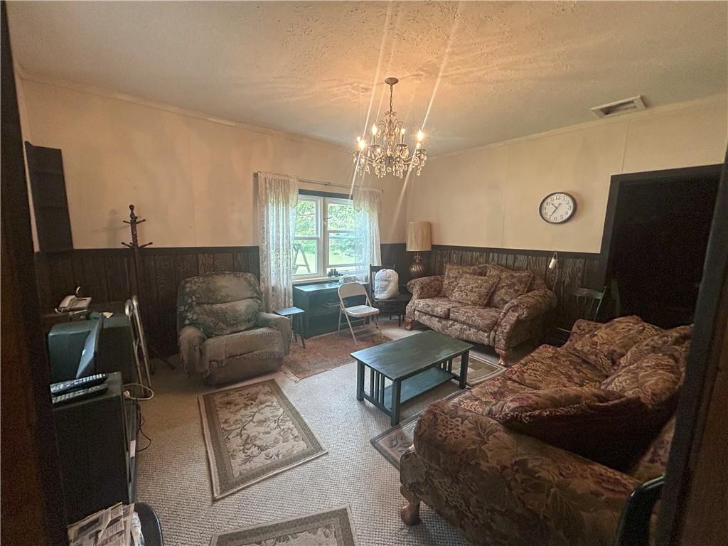 53 Hurd Road Rochester Mills, PA 15771 - Photo 6 of 35 a living room with furniture and a chandelier