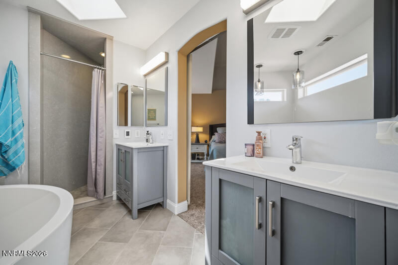 1931 Lousetown Road Reno, NV 89521 - Photo 18 of 51 a bathroom with a bathtub sink and mirror