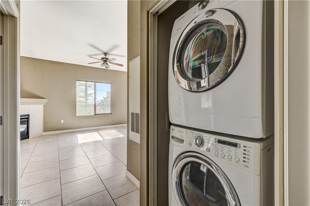 8985 South Durango Drive, Unit 2187 Las Vegas, NV 89113 - Photo 5 of 73 Functional laundry appliances stand ready in a convenient hall closet, complementing the adjacent living space.