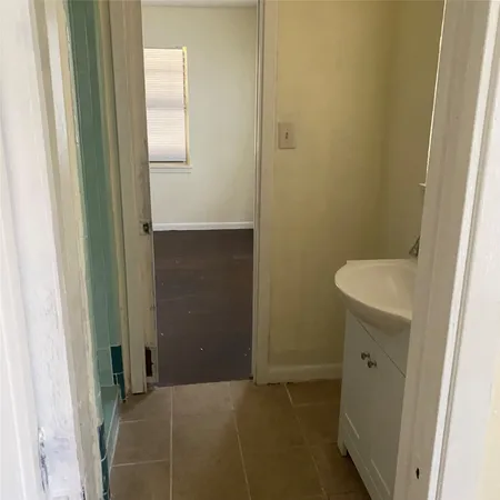 a bathroom with a sink and toilet