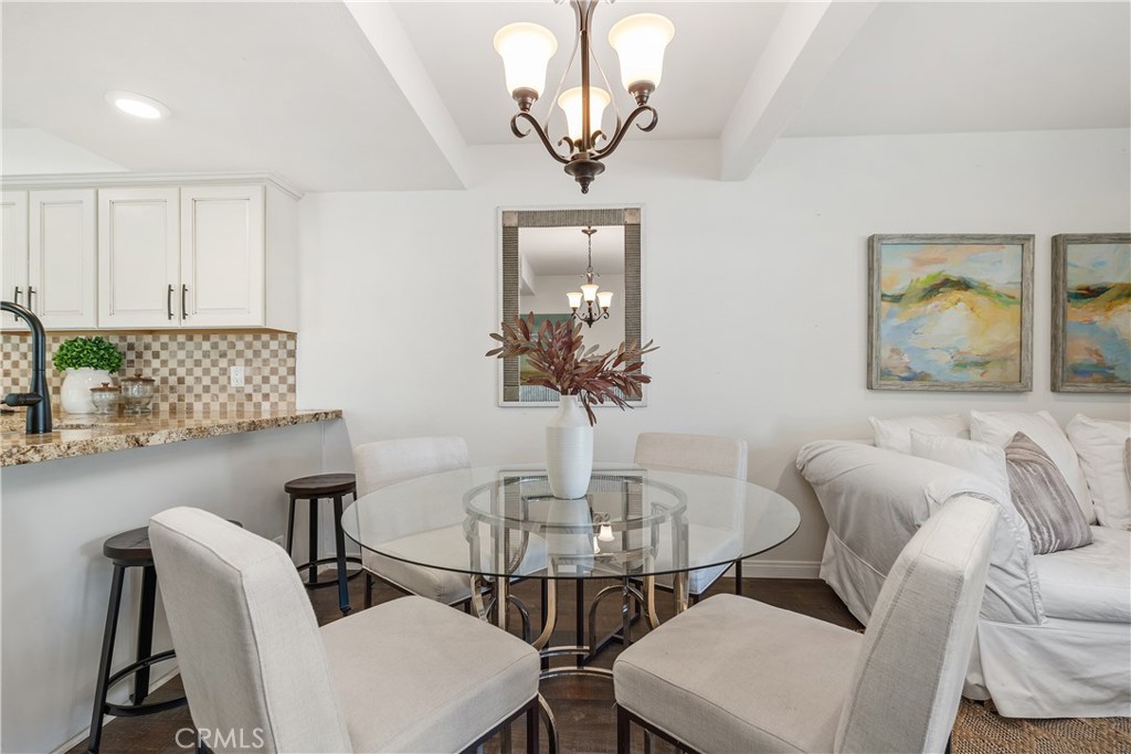 1041 Tustin Pines Way Tustin, CA 92780 - Photo 12 of 32 a view of a dining room with furniture and wooden floor