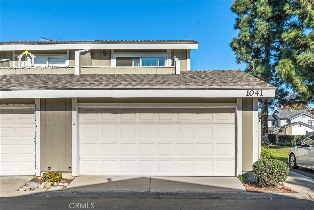1041 Tustin Pines Way Tustin, CA 92780 - Photo 2 of 32 a front view of a house with a yard